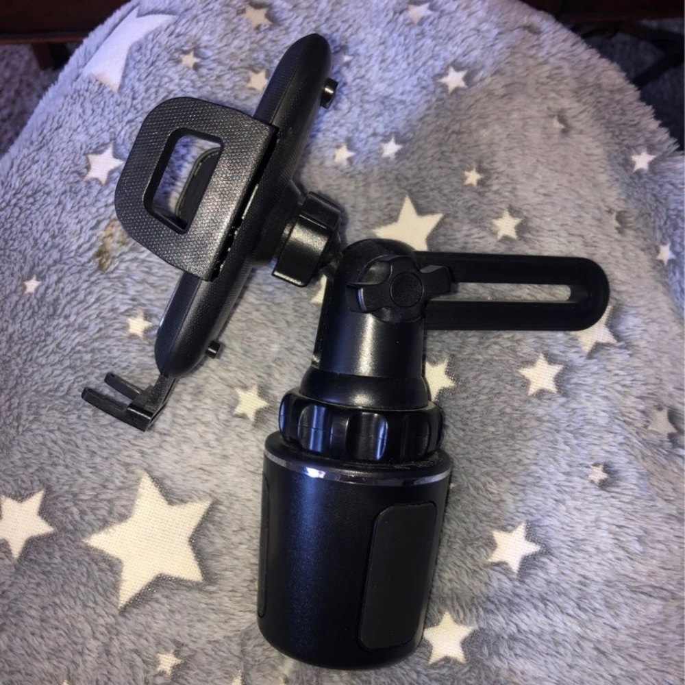 Cell phone holder for vehicle